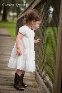 Baby Girl beind special Wooden Fence